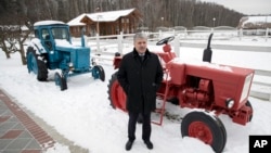 he Communist Party's candidate for the 2018 Russian presidential election Pavel Grudinin poses for a picture with old Soviet-made tractors, at Lenin state farm outside Moscow, Russia, Jan. 26, 2018.