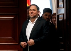 FILE - Jailed Catalan politician Oriol Junqueras leaves after getting his parliamentary credentials at Spanish Parliament, in Madrid, Spain, May 20, 2019.