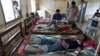 FILE - This Aug. 26, 2009 photo shows patients suffering from malaria being treated at the hospital in Pailin, Cambodia. 