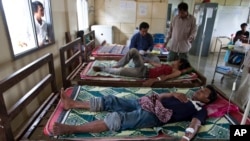 FILE - This Aug. 26, 2009 photo shows patients suffering from malaria being treated at the hospital in Pailin, Cambodia. 