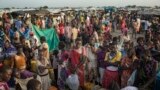 FILE - People wait to fill up water containers in Bentui, South Sudan, July 2, 2014. 