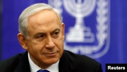 FILE - Israel's Prime Minister Benjamin Netanyahu attends a Likud-Beitenu faction meeting at parliament in Jerusalem, February 5, 2013.
