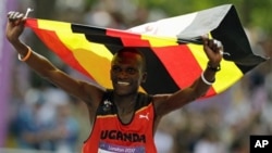 Uganda's Stephen Kiprotich celebrates after crossing the finish line to win gold in the men's marathon at the 2012 Summer Olympics