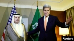 U.S. Secretary of State John Kerry (R) gestures next to Saudi Foreign Minister Adel al-Jubeir during a meeting on Syria in Geneva, Switzerland, May 2, 2016. 