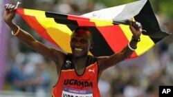 Uganda's Stephen Kiprotich celebrates after crossing the finish line to win gold in the men's marathon at the 2012 Summer Olympics Sunday, Aug. 12, 2012 in London. (AP Photo/Anja Niedringhaus)