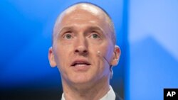 FILE - Carter Page, a former foreign policy adviser of Donald Trump, speaks at a news conference at RIA Novosti news agency in Moscow, Dec. 12, 2016. The FBI reportedly obtained a Foreign Intelligence Surveillance Court warrant for Page as part of an investigation into alleged links between Russia and the Trump campaign.