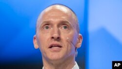 FILE - Carter Page, a former foreign policy adviser of U.S. President-elect Donald Trump, speaks at a news conference at RIA Novosti news agency in Moscow, Russia, Dec. 12, 2016. 