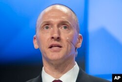 FILE - Carter Page speaks at a news conference at RIA Novosti news agency in Moscow, Russia, Dec. 12, 2016.