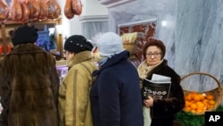 Customers line to stock up for the New Year in GUM Department Store in Red Square in Moscow, Russia, Dec. 29, 2015.