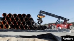 FILE - Pipes are piled up at a storage area at French pipe coating company EUPEC in Sassnitz, May 6, 2011. EUPEC is working to complete around 200,000 pipes for Nord Stream, which is building two 1,220 km-long roughly parallel gas pipelines across the Baltic Sea from Russia to Germany with an overall annual capacity of 55 billion cubic meters.