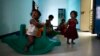 FILE - Baby girls play inside the Life Line Trust orphanage in Salem in the southern Indian state of Tamil Nadu.