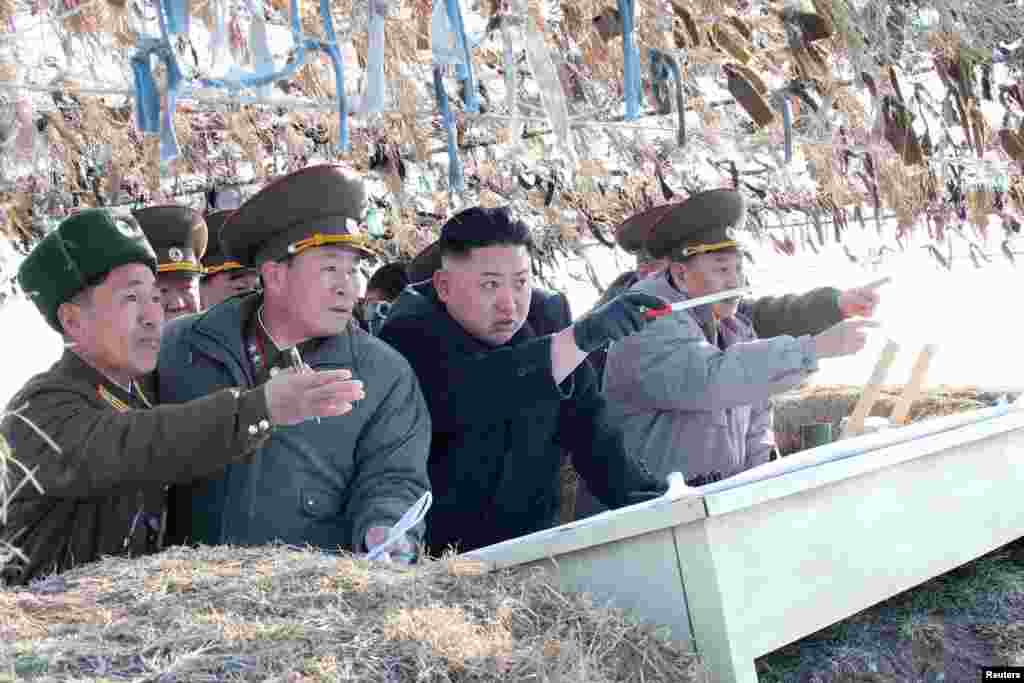 North Korean leader Kim Jong Un visits the Wolnae Islet Defence Detachment in the western sector of the front line, which is near Baengnyeong Island of South Korea, March 11, 2013. (KCNA) 