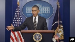 President Barack Obama gestures as speaks in the James Brady Press Briefing Room at the White House in Washington, February 5, 2013. 
