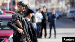 Egyptian security personnel guard the entrance to the Bella Vista Hotel in the Red Sea resort of Hurghada, Egypt, Jan. 9, 2016. 