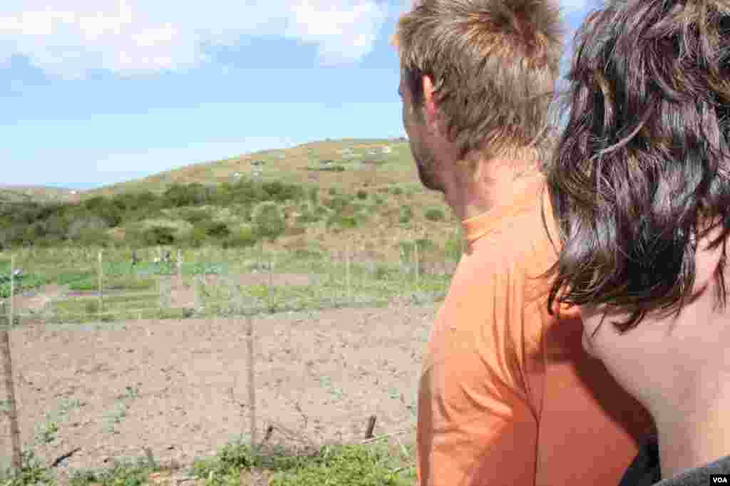 Alex and Michael Gunther gaze over their land in Hobeni in South Africa&rsquo;s Eastern Cape province (VOA/Taylor) 