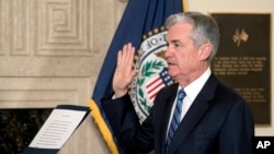 Jerome Powell takes the oath of office as the new chairman of the Federal Reserve, Feb. 5, 2018, in Washington. 