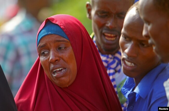 Relatives mourn the killing of their kin in an attack by Somali forces supported by U.S. troops, at the Madina hospital in Mogadishu, Somalia, Aug. 25, 2017.