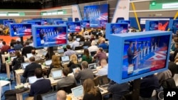 Members of the media view the Republican presidential primary debate hosted by ABC News at the St. Anselm College in Manchester, N.H., Feb. 6, 2016.