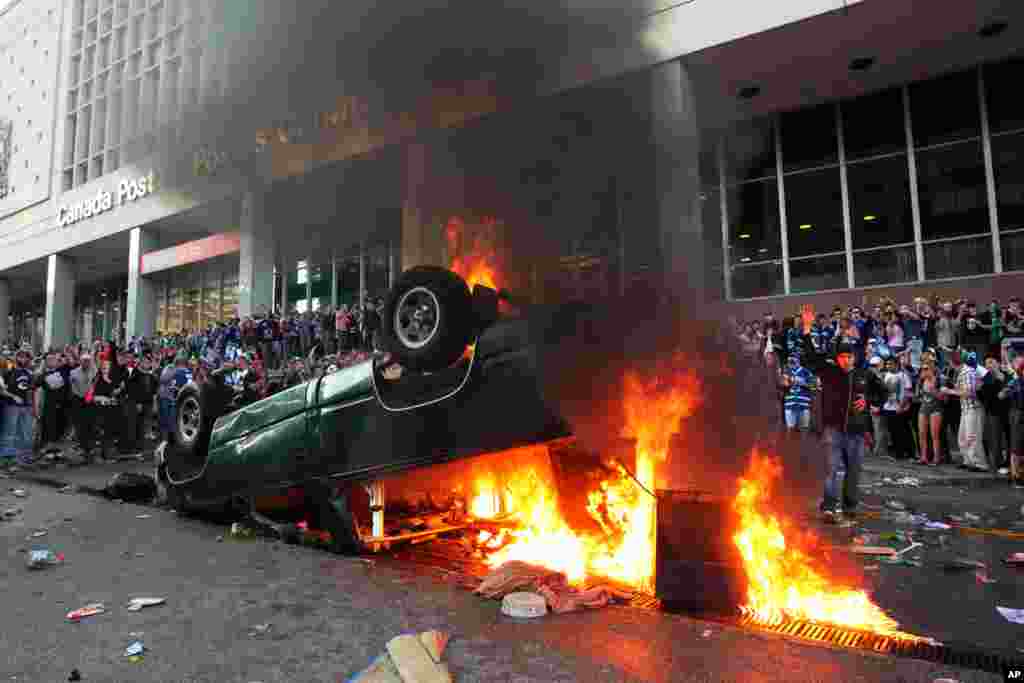 June 15: Vancouver Canucks fans rioted in downtown Vancouver, British Columbia after the Canucks lost Game 7 of the NHL Stanley Cup playoffs to the Boston Bruins. REUTERS/Anthony Bolante