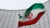 پرچم ایران بیرون از مقر آژانس بین المللی انرژی اتمی در وین - آرشیو