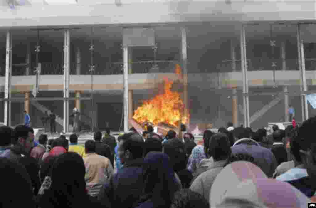 The local government headquarters, is set on fire by protesters, claiming delays on requests for housing in Port Said Thursday, Feb. 10, 2011. Labor unrest across the country gave powerful momentum to Egypt's wave of anti-government protests. With its e