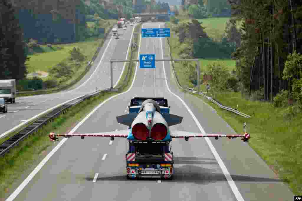 Damaged jet fighter of type Eurofighter is transported on the platform of a truck on German highway 9 near Plech, southern Germany.