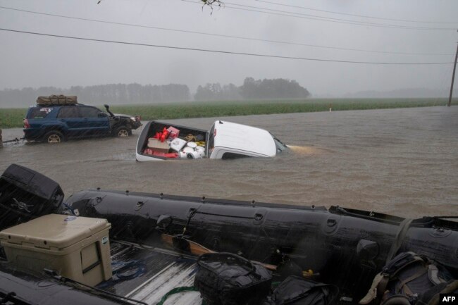 A pickup is submerged in floodwaters in Lumberton, N.C., Sept. 15, 2018, in the wake of Hurricane Florence.