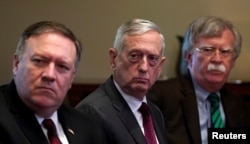 FILE - From left, U.S. Secretary of State Mike Pompeo, Secretary of Defense James Mattis and national security adviser John Bolton listen as U.S. President Donald Trump meets with NATO Secretary-General Jens Stoltenberg at the White House in Washington.