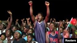 Supporters of President-elect Roch Marc Kabore cheer at his campaign headquarters in Ouagadougou, Burkina Faso, Dec. 1, 2015. 