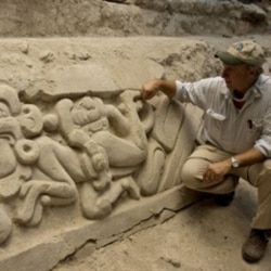 US archaeologist Richard Hansen shows a limestone frieze found at El Mirador archaeological site