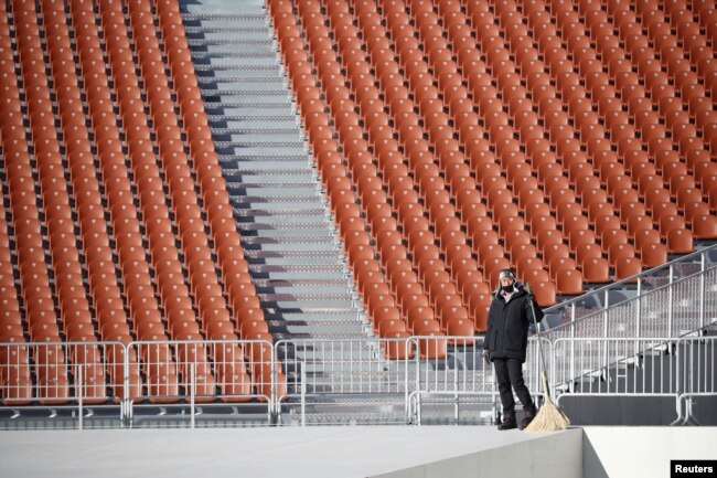 A worker is seen at the Olympic Stadium, venue for the opening and closing ceremonies of the 2018 Pyeongchang Winter Olympic Games in Pyeongchang, South Korea, Dec. 12, 2017.