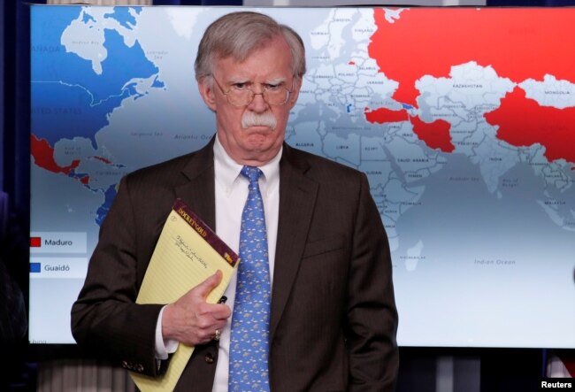 FILE - U.S. National Security Adviser John Bolton arrives to address reporters as the Trump administration announces economic sanctions against Venezuela during a press briefing at the White House in Washington, Jan. 28, 2019.