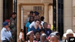 Members of the public make their way through the Union Buildings to pay their respects to former South African President Nelson Mandela during his lying in state in Pretoria, South Africa, Wednesday, Dec. 11, 2013.