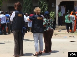 EU observers at a polling station in Dar es Salaam, Tanzania, Sunday, Oct. 25, 2015.