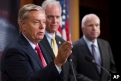 From left, Sen. Lindsey Graham, R-S.C., Sen. Ron Johnson, R-Wis., and Sen. John McCain, R-Ariz., speak to reporters at the Capitol. McCain joined two other Republican senators to defeat a measure to partly repeal the Affordable Care Act.