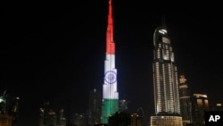 FILE - The Burj Khalifa skyscraper in Dubai, United Arab Emirates, displays the flag of India to honor the visit of Indian Prime Minister Narendra Modi, Feb. 10, 2018.