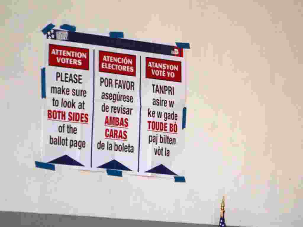 Election instructions written in English, Spanish and Creole, hang on a polling center wall in west Miami during the Republican primary election in Florida on January 31, 2012.