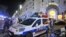 Mobil polisi diparkir dekat lokasi tempat serangan oleh truk di Nice, Perancis Selatan (15/7). (AP/Christian Alminana)