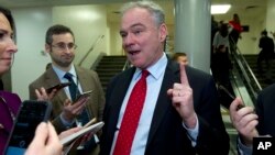 Sen. Tim Kaine D-Va., speaks to reporters, as the Senate takes up a House-passed bill that would pay for President Donald Trump's border wall and avert a partial government shutdown, in Washington, Friday, Dec. 21, 2018.