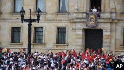 Pope Francis stands over the crowd from Cardinal's Palace where he is to give a blessing at Bolivar Square in Bogota, Colombia, Sept. 7, 2017. 