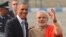 U.S. President Barack Obama, left, shakes hand with Indian Prime Minister Narendra Modi, upon arrival at the Palam Air Force Station in New Delhi, Jan. 25, 2015.