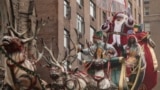 FILE - Santa Claus is seen along Central Park West during the Macy's Thanksgiving Day parade, Thursday, Nov. 28 2024, in New York. (AP Photo/Yuki Iwamura)