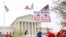People rally outside the Supreme Court, Nov. 12, 2019, in Washington.