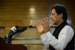 Pakistani Prime Minister Imran Khan addresses Kashmir's Legislative Assembly on the occasion of Pakistan's Independence Day, in Muzaffarabad, capital of Pakistani Kashmir, Aug. 14, 2019.