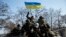 在明斯克停战协议签订后，乌克兰军人在装甲运兵车上（2012年2月12日）
