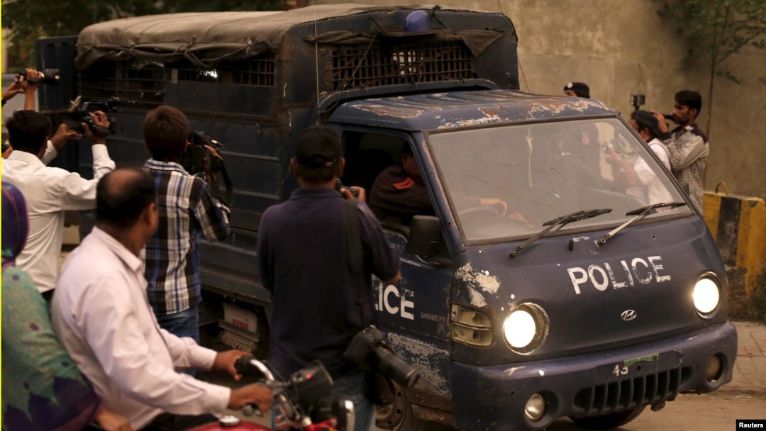 Pakistani police drive men accused of child abuse to the Lahore High Court in Pakistan, August 11, 2015.