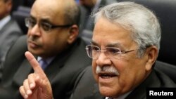 FILE - Saudi Arabian Oil Minister Ali al-Naimi talks to journalists before a meeting of OPEC oil ministers at OPEC's headquarters in Vienna, Nov. 27, 2014.