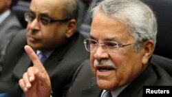 FILE - Saudi Arabian Oil Minister Ali al-Naimi talks to journalists before a meeting of OPEC oil ministers at OPEC's headquarters in Vienna, Nov. 27, 2014.