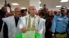 FILE - Mohamed Ould Ghazouani (C) casts his ballot at a polling station on June 22, 2019 in Nouakchott. 