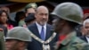 FILE - Then-Surinamese President Desi Bouterse attends a military parade after his swearing-in ceremony in Paramaribo, Suriname, on Aug. 12, 2010.